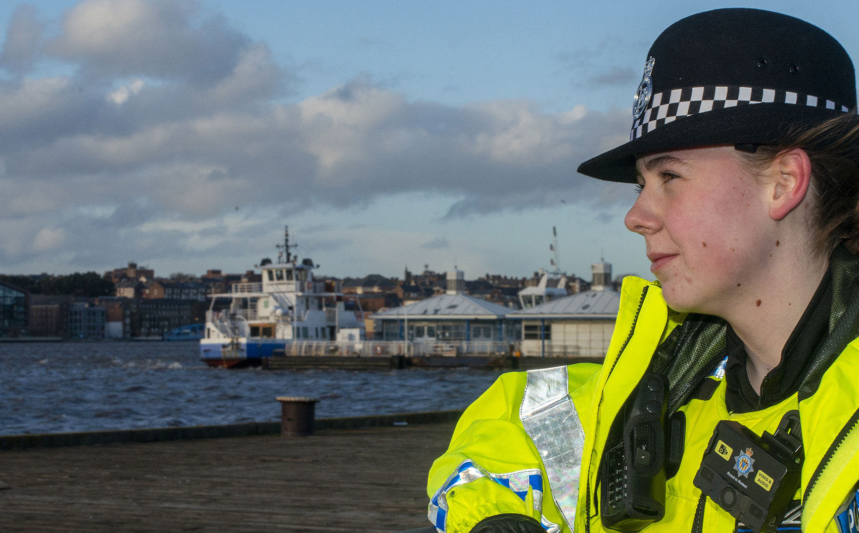 Northumbria police volunteer - Female Special Constable staring across waters edge