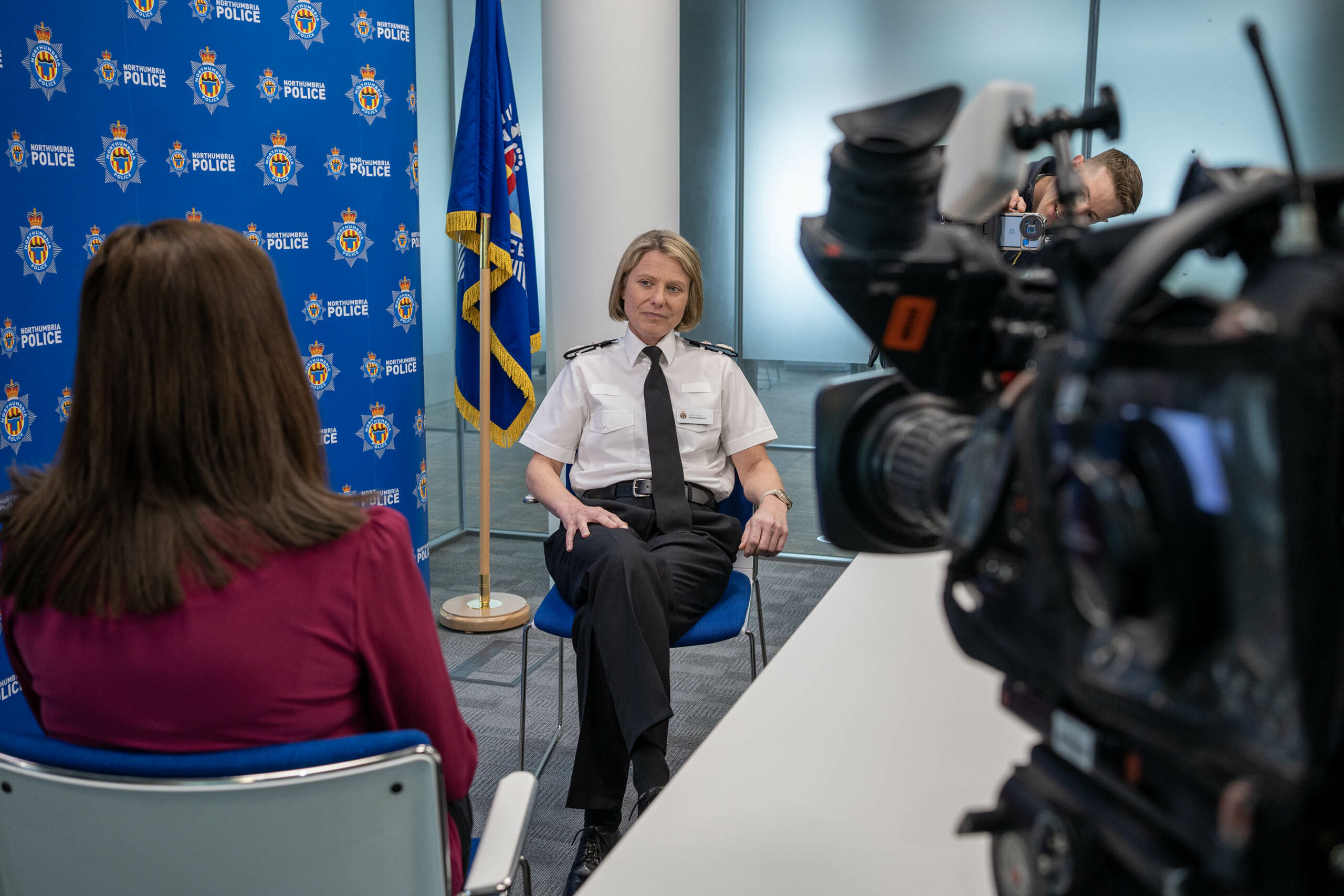 Chief Constable Vanessa Jardine sat with a media adviser in front of a press camera